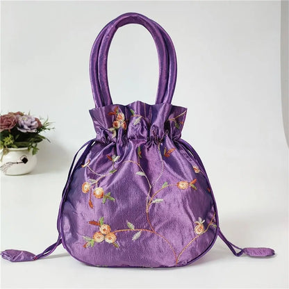 Sac à main bourse en satin avec broderies florales