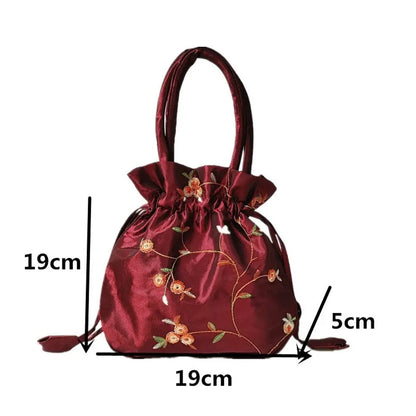 Sac à main bourse en satin avec broderies florales
