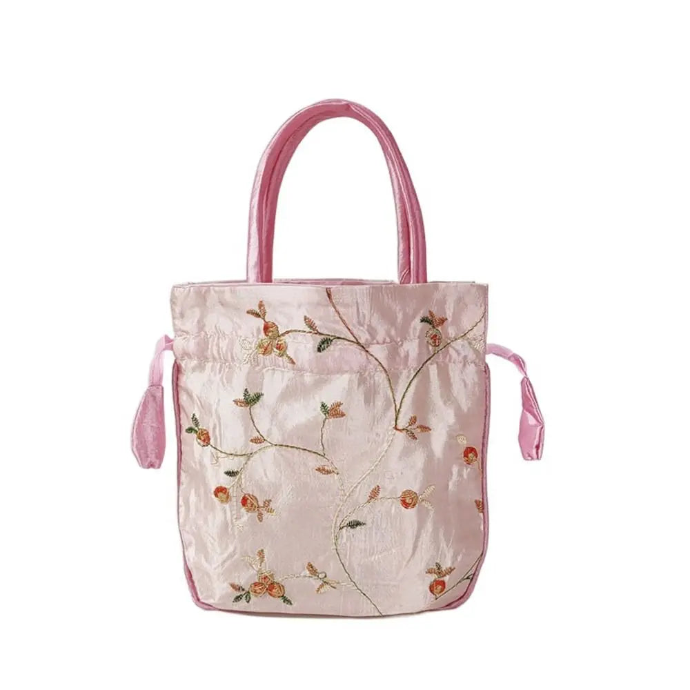 Sac à main bourse en satin avec broderies florales