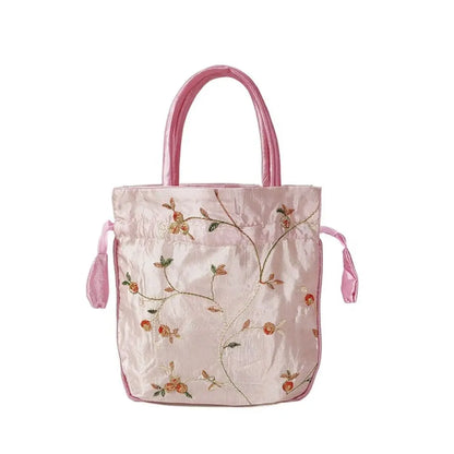 Sac à main bourse en satin avec broderies florales