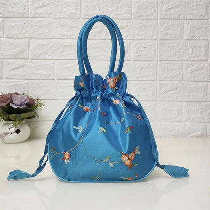 Sac à main bourse en satin avec broderies florales