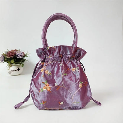Sac à main bourse en satin avec broderies florales